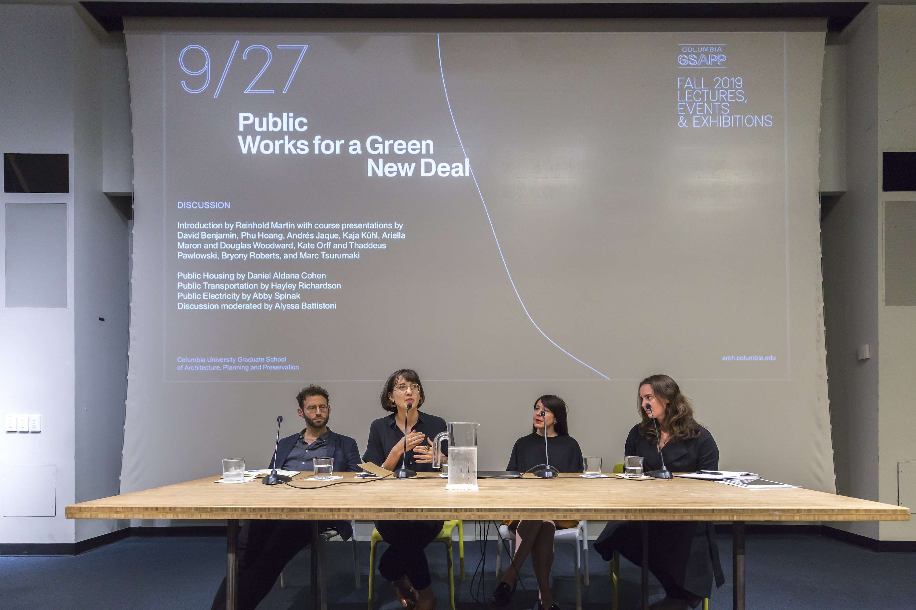 Image of panel discussion at "Public Works for a Green New Deal." Discussion moderated by Alyssa Battistoni, seen next to Daniel Aldana Cohen.