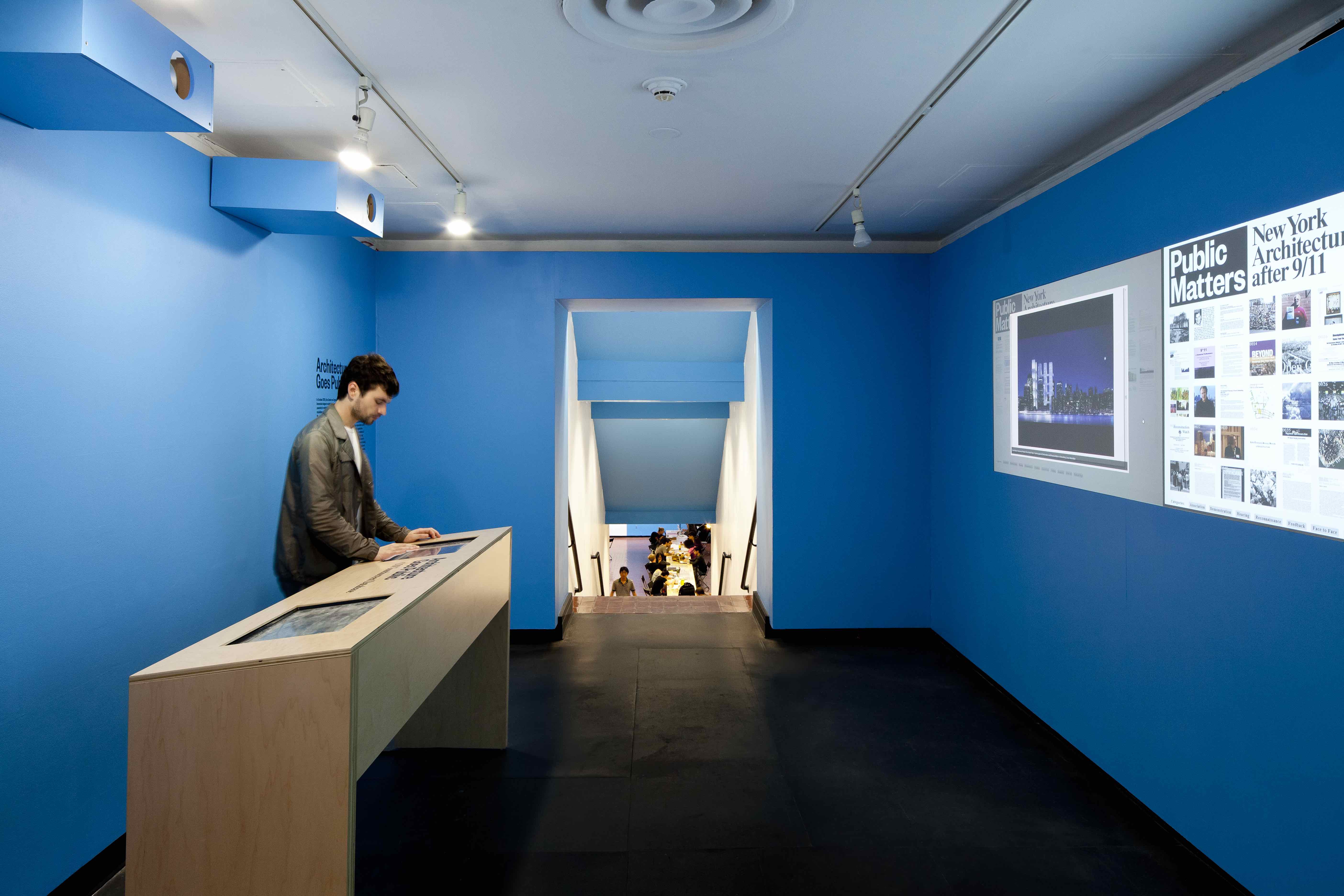 A man looking at the exhibition table