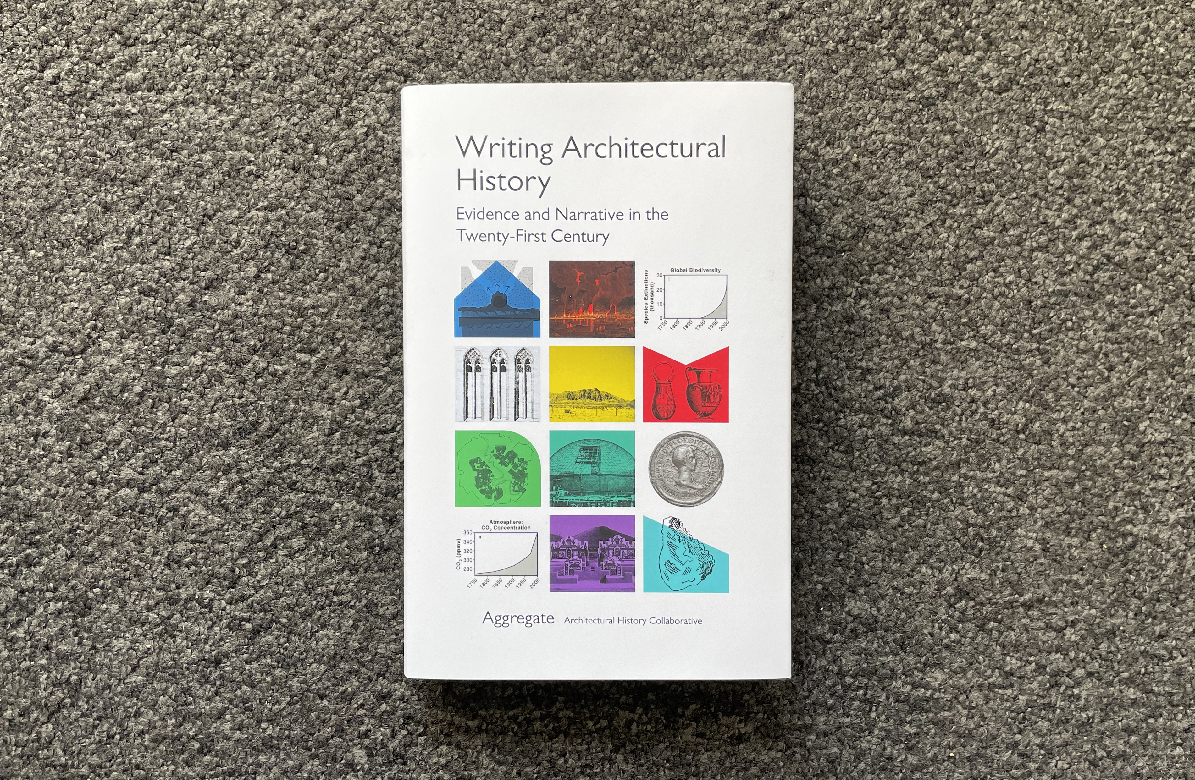 On a textured grey background, a white book with a brightly colored grid of varying illustrations reads: "Writing Architectural History: Evidence and Narrative in the Twenty-First Century." The book is edited by the Aggregate Architectural History Collaborative.